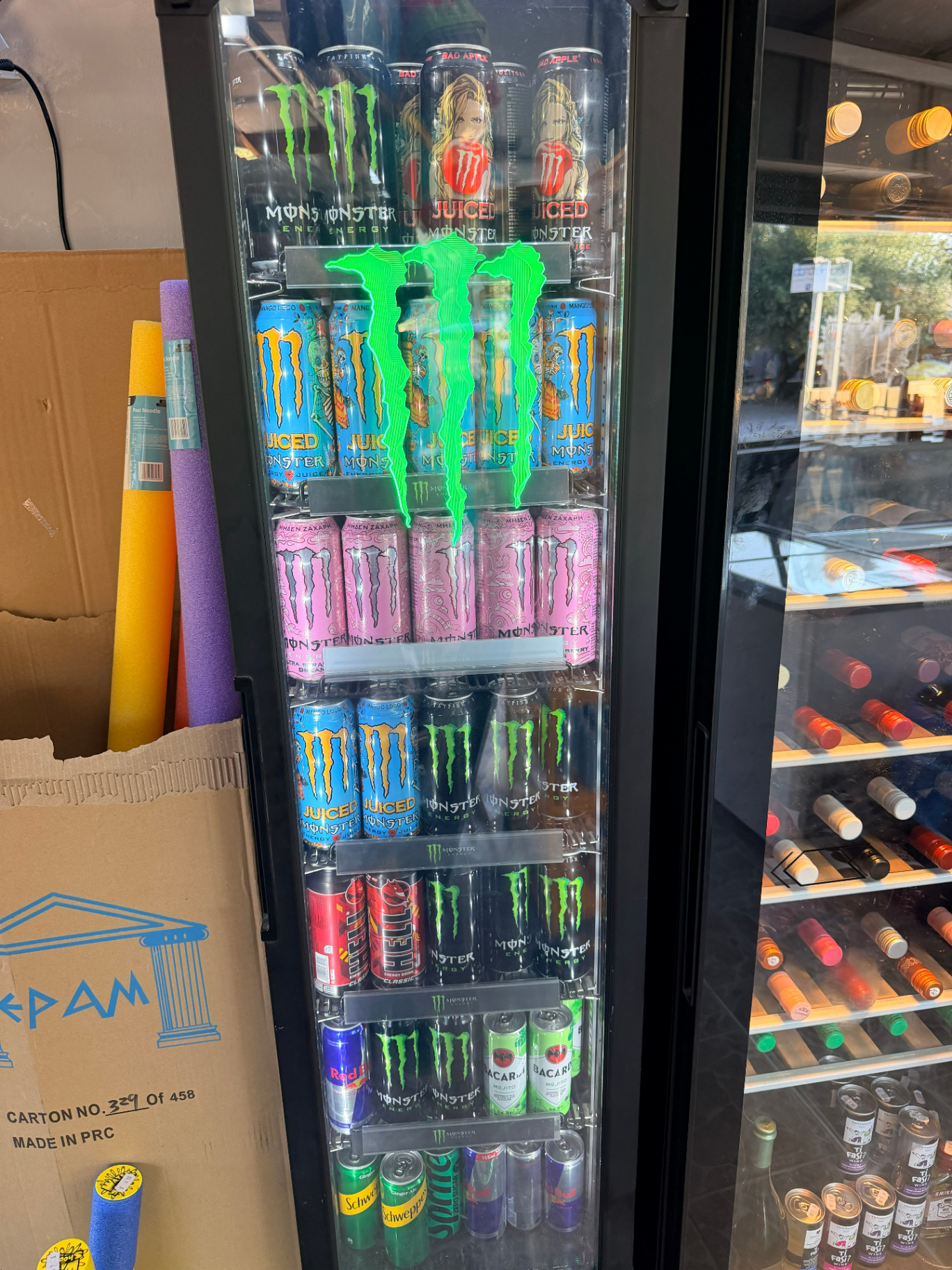 Monster Energy fridge with Red Bull and cold energy drinks at AMOS SEASIDE Mini Market near Marathi Beach Chania